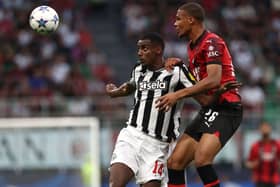 AC Milan defender Malick Thiaw challenges Newcastle United striker Alexander Isak for a header. (Photo by Marco Luzzani/Getty Images)