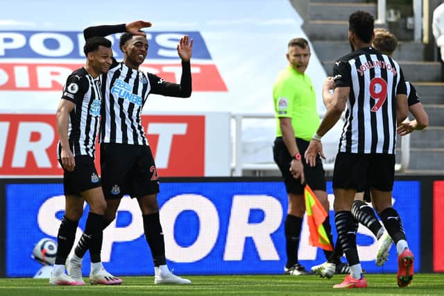 Joe Willock of Newcastle United celebrates with teammates Jacob Murphy and Joelinton after scoring his team’s third goal during the Premier League match between Newcastle United and West Ham United at St. James Park on April 17, 2021 in Newcastle upon Tyne, England. 