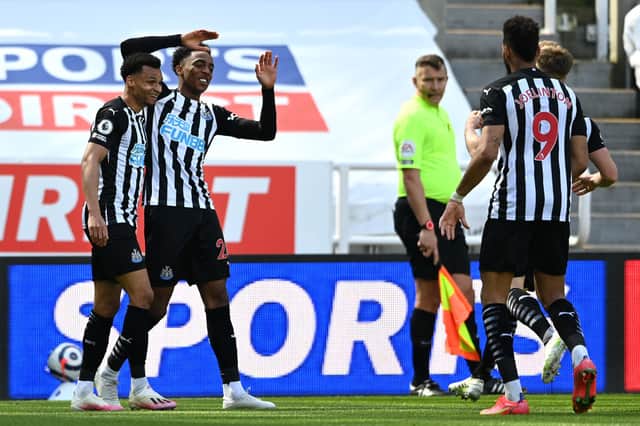 Joe Willock of Newcastle United celebrates with teammates Jacob Murphy and Joelinton after scoring his team’s third goal during the Premier League match between Newcastle United and West Ham United at St. James Park on April 17, 2021 in Newcastle upon Tyne, England.