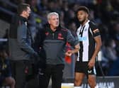 Newcastle manager Steve Bruce speaks to Joelinton of Newcastle during the pre-season friendly between Burton Albion and Newcastle United at the Pirelli Stadium on July 30, 2021 in Burton-upon-Trent, England.