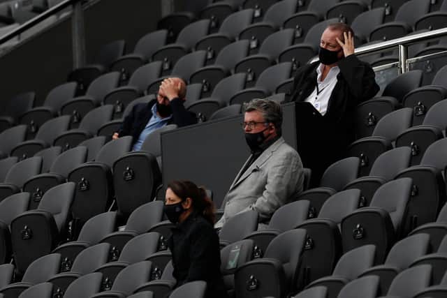 Newcastle United’s English owner Mike Ashley (R) watches his side lose the English Premier League football match between Newcastle United and Brighton and Hove Albion at St James’ Park in Newcastle upon Tyne, north-east England on September 20, 2020. 
