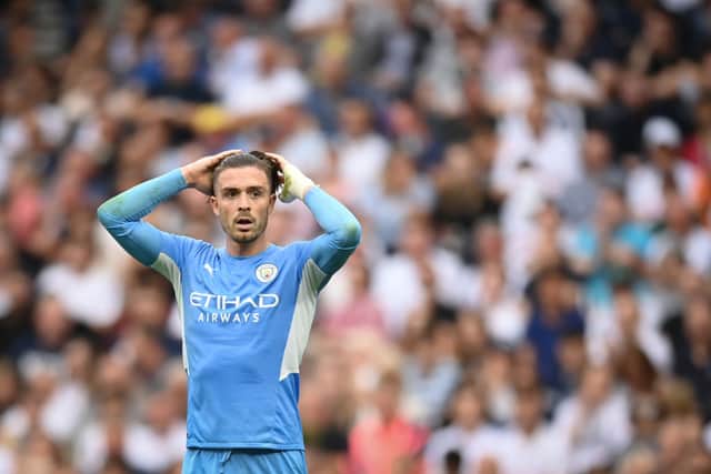 Jack Grealish of Manchester City looks dejected during the Premier League match between Tottenham Hotspur  and  Manchester City at Tottenham Hotspur Stadium on August 15, 2021 in London, England. (Photo by Michael Regan/Getty Images)
