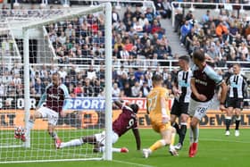 Freddie Woodman of Newcastle United fails to save a shot leading to the first goal of West Ham United during the Premier League match between Newcastle United and West Ham United at St. James Park on August 15, 2021 in Newcastle upon Tyne, England.
