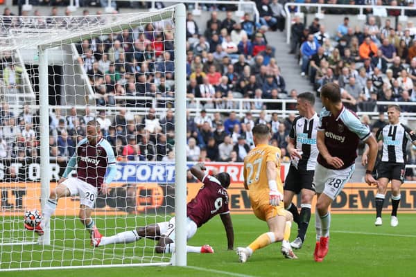 Freddie Woodman of Newcastle United fails to save a shot leading to the first goal of West Ham United during the Premier League match between Newcastle United and West Ham United at St. James Park on August 15, 2021 in Newcastle upon Tyne, England.