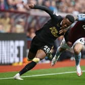 Douglas Luiz of Aston Villa battles for possession with Joe Willock of Newcastle United during the Premier League match between Aston Villa and Newcastle United at Villa Park on August 21, 2021 in Birmingham, England. 