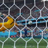 Slovakia’s goalkeeper Martin Dubravka dives to save a goal during the UEFA EURO 2020 Group E football match between Slovakia and Spain at La Cartuja Stadium in Seville on June 23, 2021. 