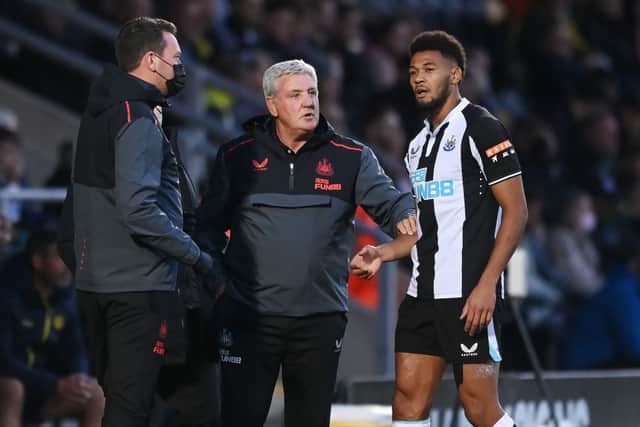 Newcastle manager Steve Bruce speaks to Joelinton of Newcastle during the pre-season friendly between Burton Albion and Newcastle United at the Pirelli Stadium on July 30, 2021 in Burton-upon-Trent, England. 
