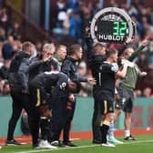 Fourth Official, Matthew Donohue raises the substitute board during the Premier League match between Aston Villa and Newcastle United at Villa Park on August 21, 2021 in Birmingham, England.