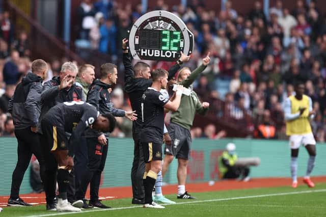 Fourth Official, Matthew Donohue raises the substitute board during the Premier League match between Aston Villa and Newcastle United at Villa Park on August 21, 2021 in Birmingham, England.