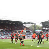 Players of Newcastle United warm up prior to the Premier League match between Aston Villa and Newcastle United at Villa Park on August 21, 2021 in Birmingham, England.
