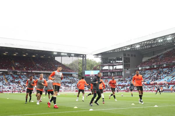 Players of Newcastle United warm up prior to the Premier League match between Aston Villa and Newcastle United at Villa Park on August 21, 2021 in Birmingham, England.