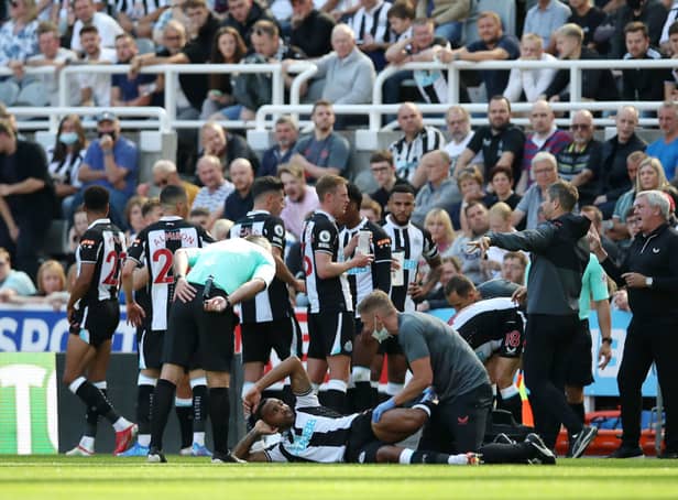 <p>Callum Wilson of Newcastle United receives medical attention during the Premier League match between Newcastle United  and  Southampton at St. James Park on August 28, 2021 in Newcastle upon Tyne, England. </p>