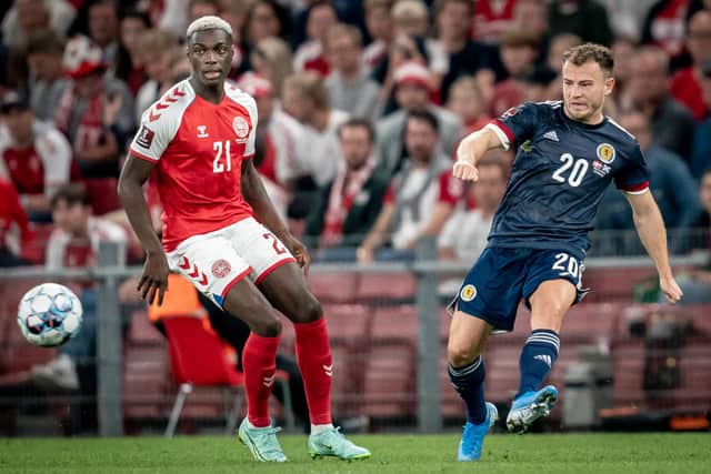 Denmark’s Mohamed Daramy (L) fights for the ball with Scotland’s Ryan Fraser during the FIFA World Cup Qatar 2022 qualification football match between Denmark and Scotland in Copenhagen on September 1, 2021. 