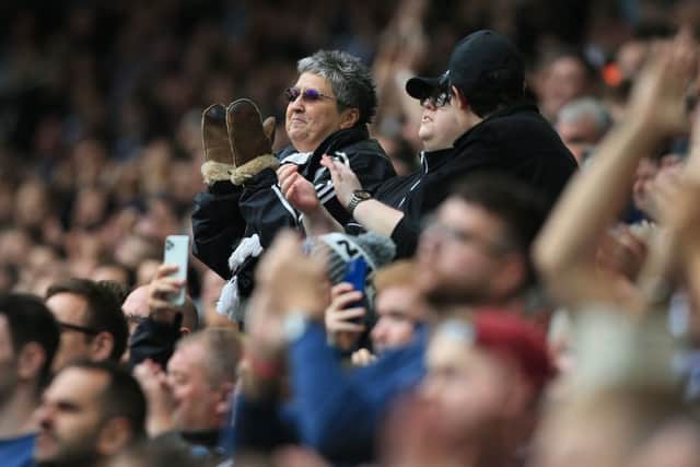 Newcastle fans applaud their players ahead of the English Premier League football match between Newcastle United and West Ham United at St James’ Park in Newcastle-upon-Tyne, north east England on August 15, 2021.