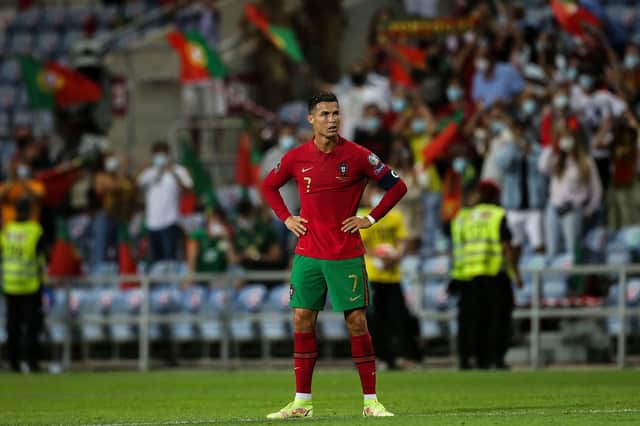 Portugal’s forward Cristiano Ronaldo reacts after the FIFA World Cup Qatar 2022 European qualifying round group A football match between Portugal and Republic of Ireland at the Algarve stadium in Loule, near Faro, southern Portugal, on September 1, 2021. 