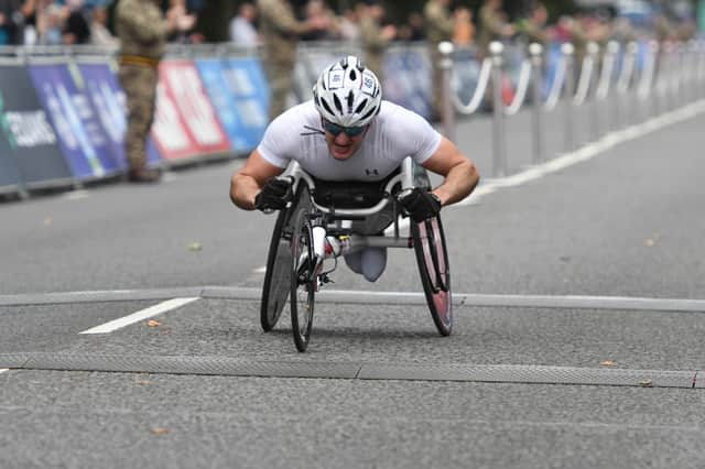 Sean Frame crossing the line to win the Men’s Wheelchair race (Kevin Brady)