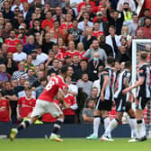 Freddie Woodman of Newcastle United fails to save a shot from Bruno Fernandes of Manchester United as he scores their side’s third goal during the Premier League match between Manchester United and Newcastle United at Old Trafford on September 11, 2021 in Manchester, England.