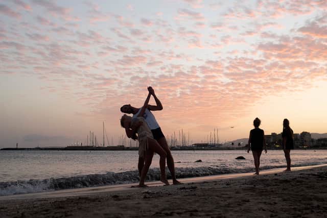 Tourists dance in Palma (Image: Getty Images)