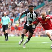 Luke Shaw of Manchester United battles for possession with Joe Willock of Newcastle United during the Premier League match between Manchester United and Newcastle United at Old Trafford on September 11, 2021 in Manchester, England.