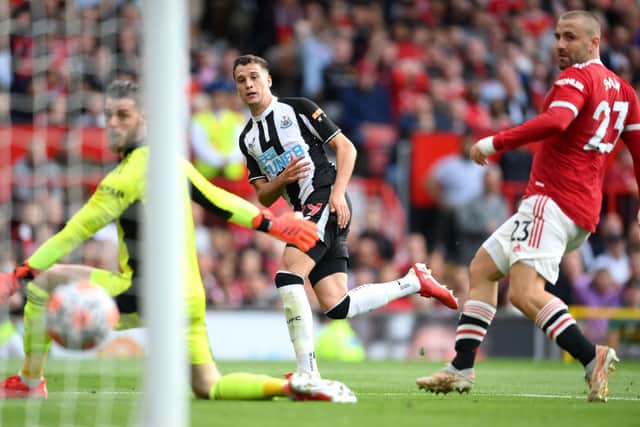 Javier Manquillo of Newcastle Uited scores their side’s first goal during the Premier League match between Manchester United and Newcastle United at Old Trafford on September 11, 2021 in Manchester, England. 