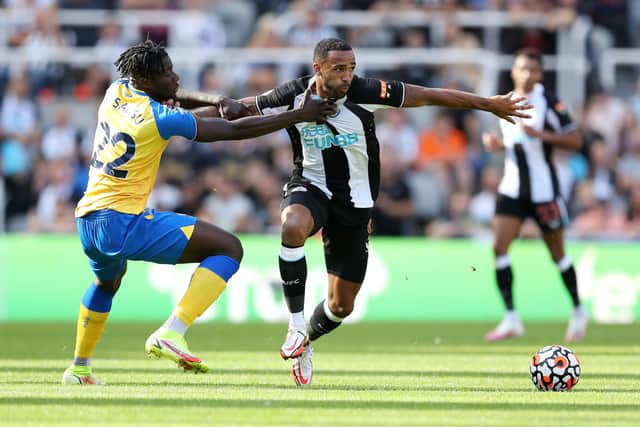 Callum Wilson of Newcastle United battles for possession with Mohammed Salisu of Southampton  during the Premier League match between Newcastle United  and  Southampton at St. James Park on August 28, 2021 in Newcastle upon Tyne, England. 