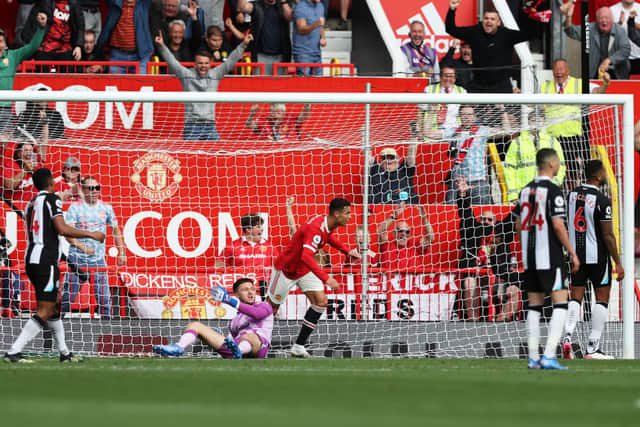 Cristiano Ronaldo of Manchester United celebrates after scoring their side’s first goal during the Premier League match between Manchester United and Newcastle United at Old Trafford on September 11, 2021 in Manchester, England. 