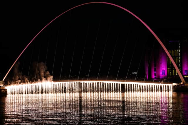 The Millennium Bridge glows at night (Image: Getty Images)