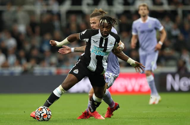 Kalvin Phillips of Leeds United vies with Allan Saint- Maximim of Newcastle United during the Premier League match between Newcastle United and Leeds United at St. James Park on September 17, 2021 in Newcastle upon Tyne, England.