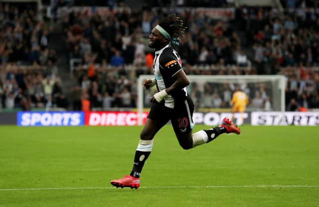 Allan Saint-Maximin of Newcastle United  celebrates after scoring their team’s first goal  during the Premier League match between Newcastle United and Leeds United at St. James Park on September 17, 2021 in Newcastle upon Tyne, England. 