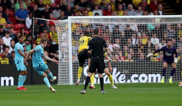 Sean Longstaff of Newcastle United scores their team’s first goal during the Premier League match between Watford and Newcastle United at Vicarage Road on September 25, 2021 in Watford, England.