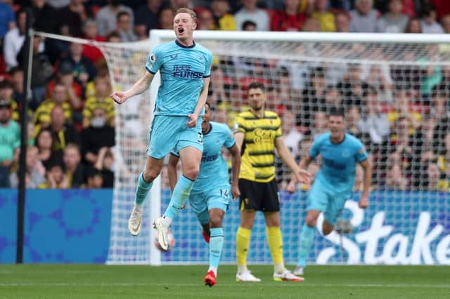 Sean Longstaff of Newcastle United celebrates scoring his sides first goal during the Premier League match between Watford and Newcastle United at Vicarage Road on September 25, 2021 in Watford, England.