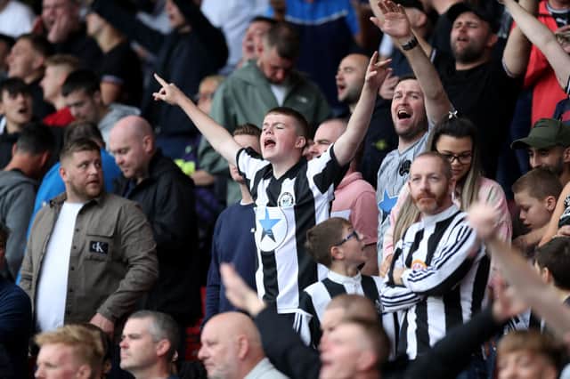 Fans of Newcastle United show their support prior to the Premier League match between Watford and Newcastle United at Vicarage Road on September 25, 2021 in Watford, England.