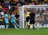 Sean Longstaff of Newcastle United scores their team’s first goal   during the Premier League match between Watford and Newcastle United at Vicarage Road on September 25, 2021 in Watford, England. 