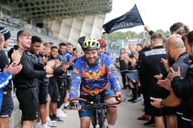 Newcastle Falcons players cheer off Matt and Mark as they depart Kingston Park Stadium.