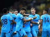 Sean Longstaff of Newcastle United celebrates scoring his sides first goal with team mates during the Premier League match between Watford and Newcastle United at Vicarage Road on September 25, 2021 in Watford, England. 