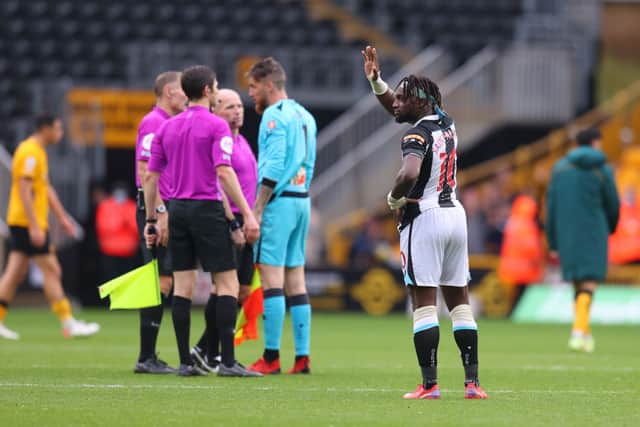 Allan Saint-Maximin of Newcastle United acknowledges the fans following defeat in the Premier League match between Wolverhampton Wanderers and Newcastle United at Molineux on October 02, 2021 in Wolverhampton, England. 