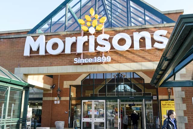 <p>Shoppers outside the front of a Morrisons store in Hatch End, London.</p>