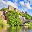 Durham Castle and Cathedral on their rock above the city, and Framwellgate Bridge spanning the River Wear, England, UK