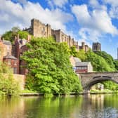 Durham Castle and Cathedral on their rock above the city, and Framwellgate Bridge spanning the River Wear, England, UK
