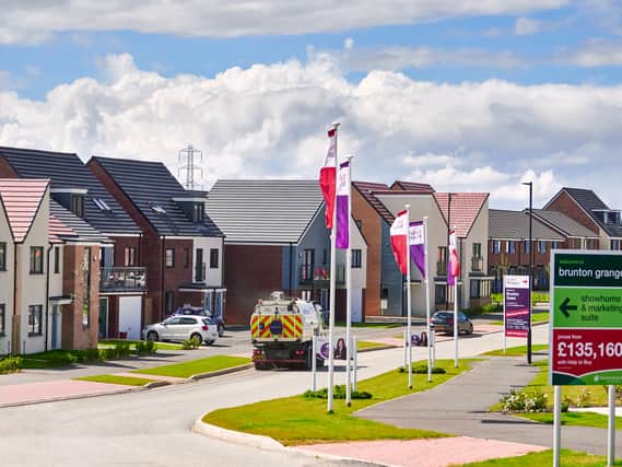 NEWCASTLE UPON TYNE, ENGLAND, UK - AUGUST 15, 2017: Newly built homes by Taylor Wimpey in a residential estate in England.