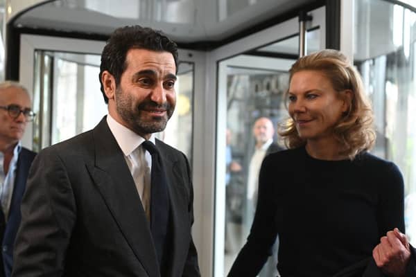 Newcastle United’s new director Amanda Staveley (R) and husband Mehrdad Ghodoussi (L) talk to the media as she leaves the foyer of St James’ Park in Newcastle upon Tyne in northeast England on October 8, 2021.