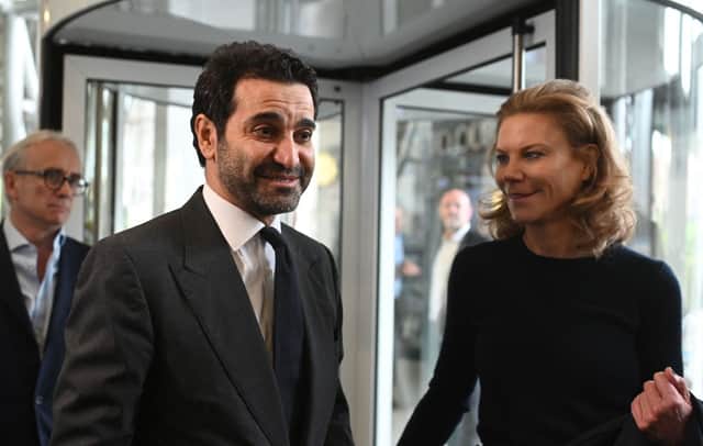 Newcastle United’s new director Amanda Staveley (R) and husband Mehrdad Ghodoussi (L) talk to the media as she leaves the foyer of St James’ Park in Newcastle upon Tyne in northeast England on October 8, 2021.