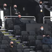 Lee Charnley, managing director of Newcastle United (c) watches from the directors box where everyone is masked and socially distanced during the Premier League match between Newcastle United and West Bromwich Albion at St. James Park on December 12, 2020,