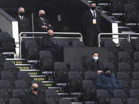 Lee Charnley, managing director of Newcastle United (c) watches from the directors box where everyone is masked and socially distanced during the Premier League match between Newcastle United and West Bromwich Albion at St. James Park on December 12, 2020,