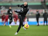 Jonjo Shelvey of Newcastle United warms up prior to the Premier League match between Newcastle United and Liverpool at St. James’ Park on December 30, 2020 in Newcastle upon Tyne, England. The match will be played without fans, behind closed doors as a Covid-19 precaution. 