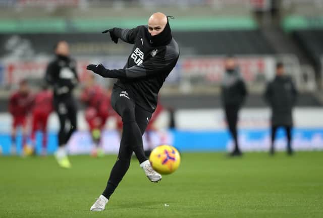 <p>Jonjo Shelvey of Newcastle United warms up prior to the Premier League match between Newcastle United and Liverpool at St. James’ Park on December 30, 2020 in Newcastle upon Tyne, England. The match will be played without fans, behind closed doors as a Covid-19 precaution. </p>