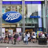 Members of the public walk past a branch of Boots the chemist (Pic from Getty)