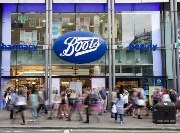 Members of the public walk past a branch of Boots the chemist (Pic from Getty)