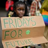 School children take part in a climate strike popularised by Swedish activist Greta Thunberg on September 24, 2021 in Glasgow, Scotland (Photo by Jeff J Mitchell/Getty Images)