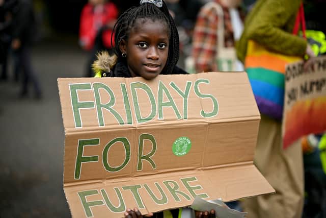 School children take part in a climate strike popularised by Swedish activist Greta Thunberg on September 24, 2021 in Glasgow, Scotland (Photo by Jeff J Mitchell/Getty Images)
